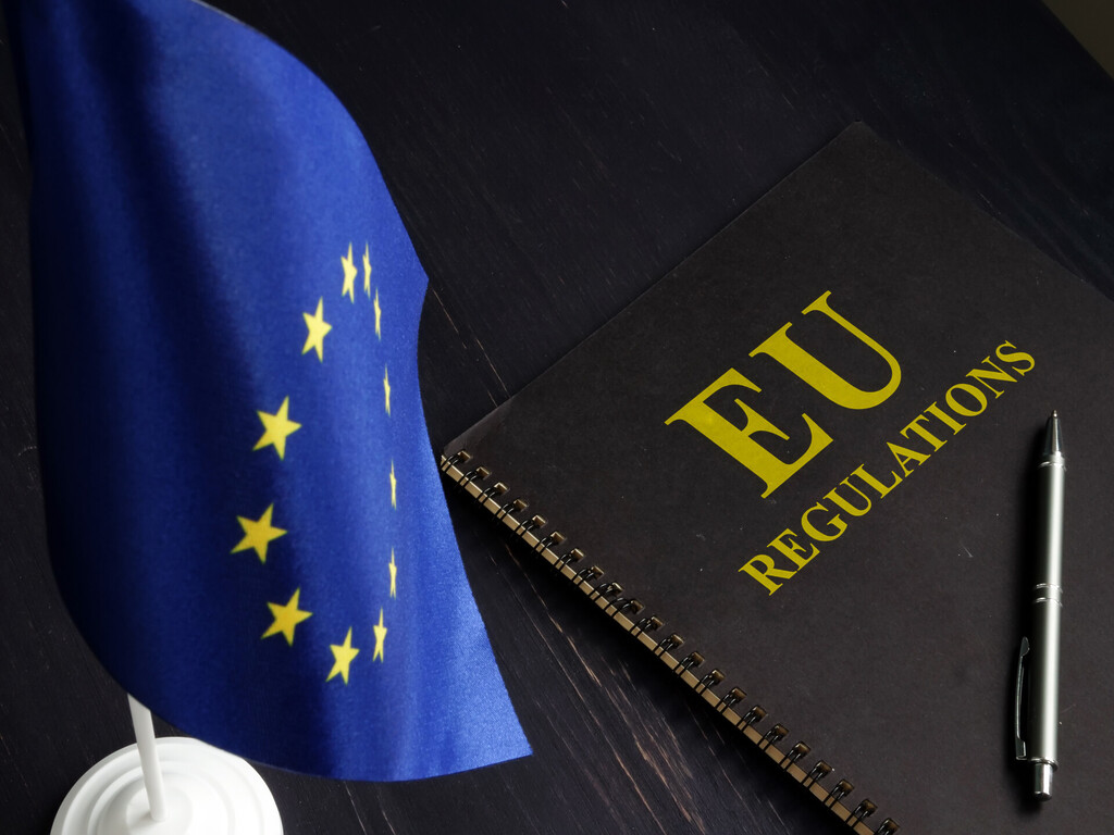 LNG market access and EU climate measures illustrated by an EU flag and regulations notebook